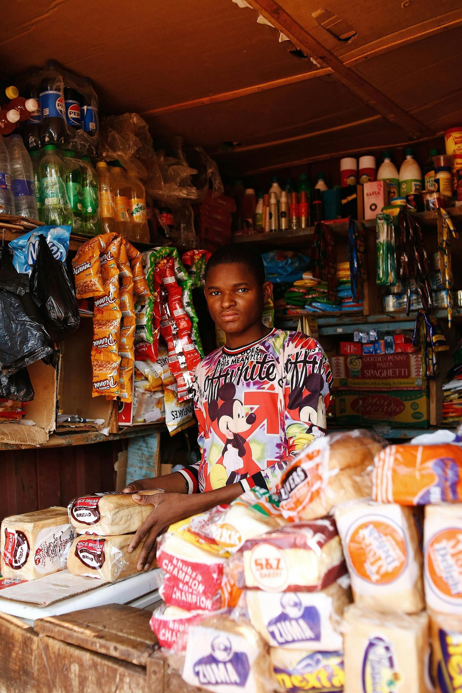 Independent shopkeeper standing inside their store